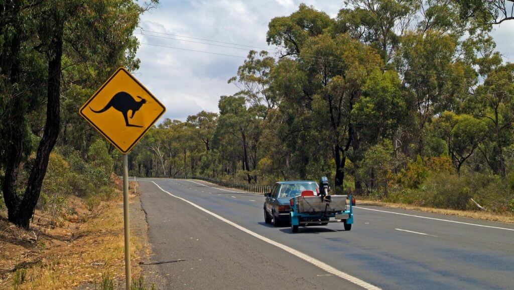 driving car and yellow sign on Australian road