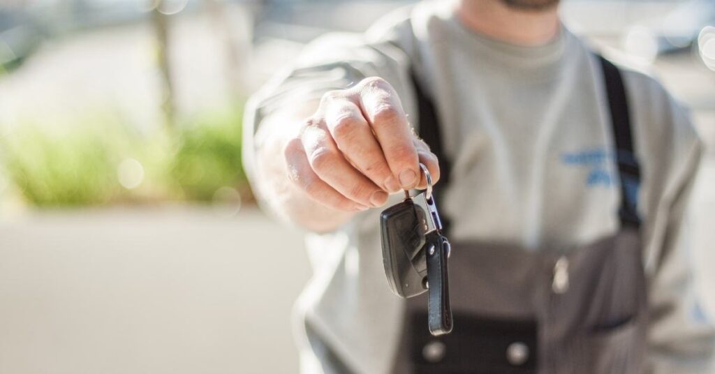 car key holding man