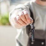 car key holding man