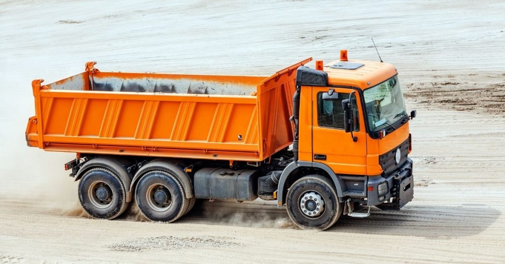 orange truck on field