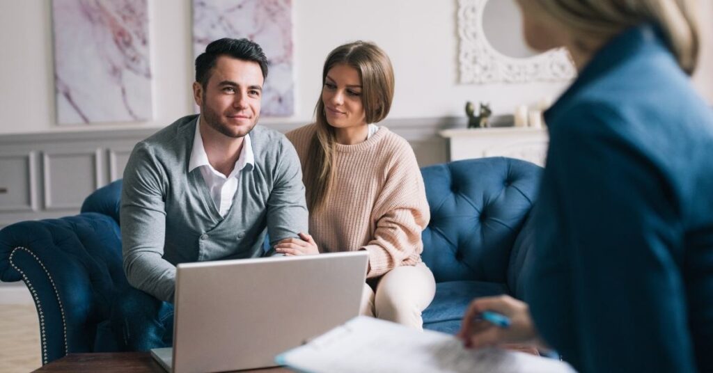 young couple sitting on a couch