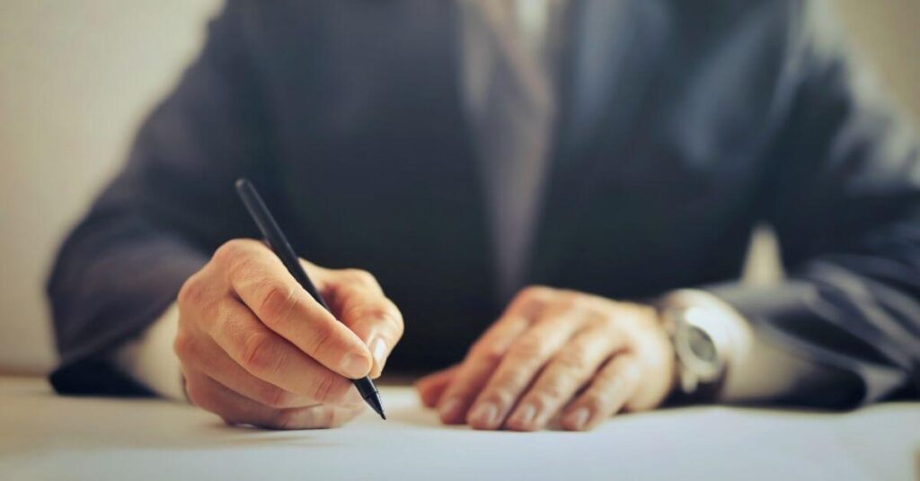 lawyer holds a pen