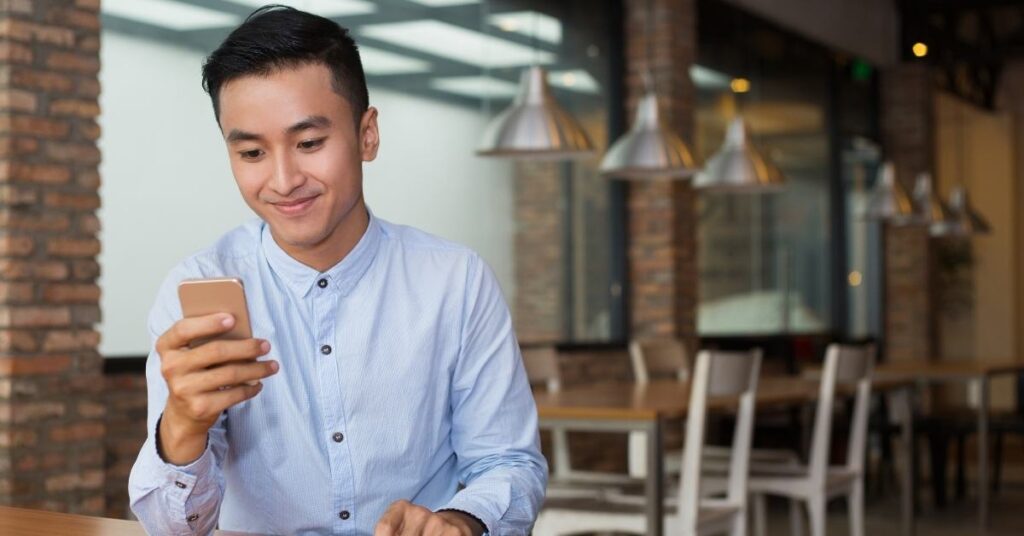 adult man using his mobile phone