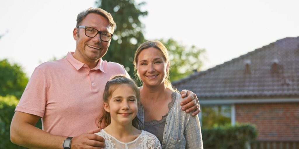 happy mum dad and daughter