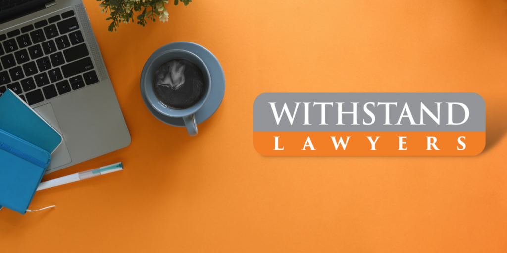 withstand lawyers logo on orange desk