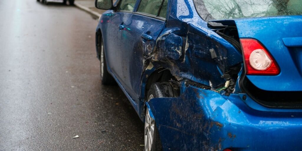damaged blue car in australia