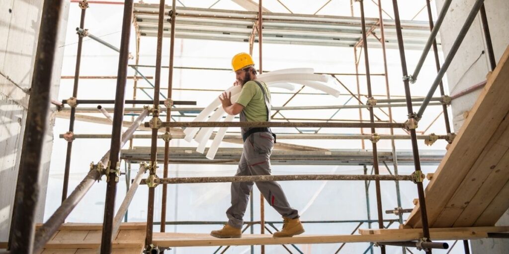 construction worker carrying heavy