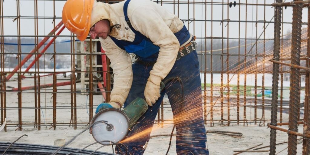 male worker cutting 