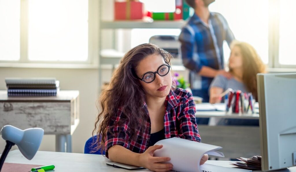 bullied sad female worker sitting