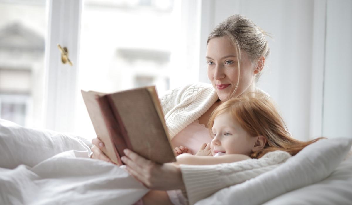 mum and kid reading book