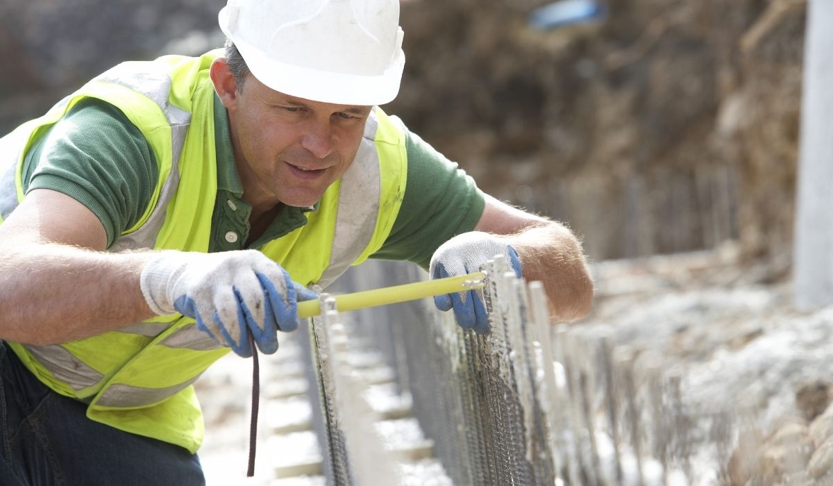 worker measuring construction