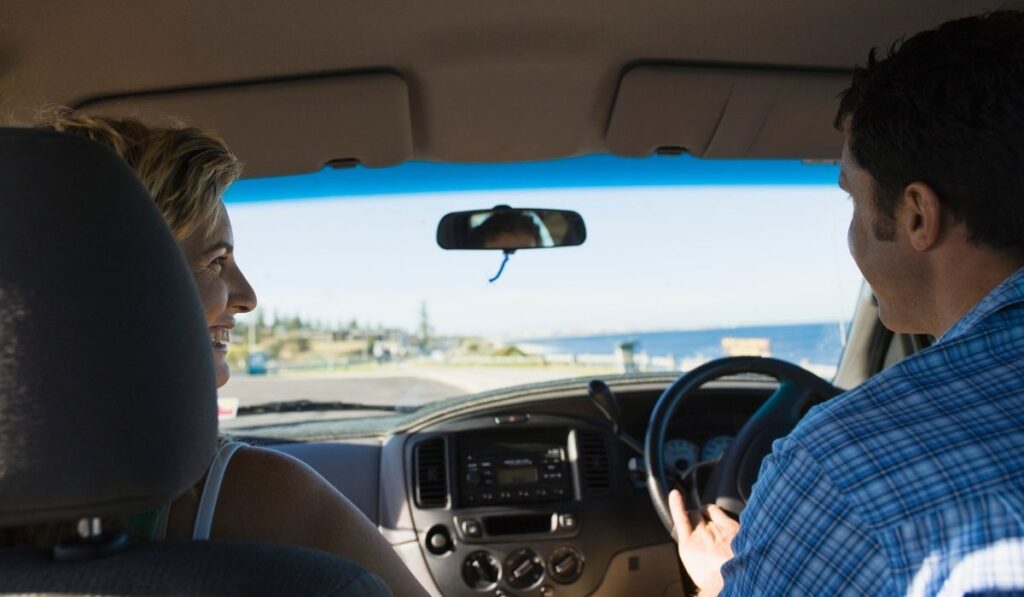 australia couple driving a car