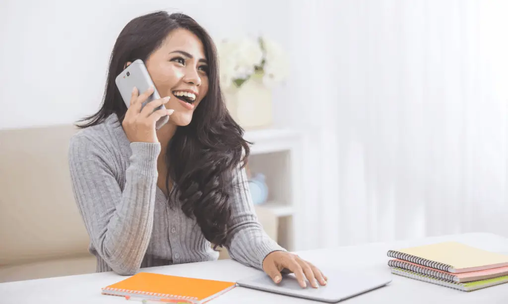 woman happy to hear what her claim is worth from a free claim check