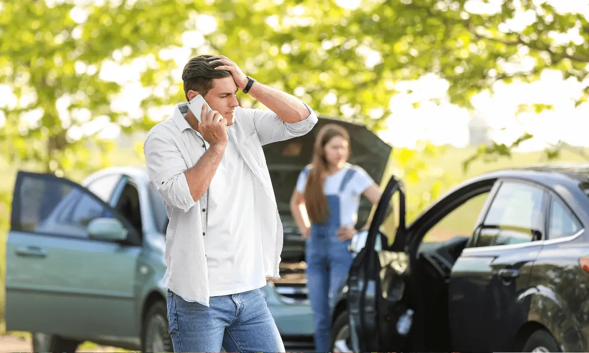 Man thinking what to do after a car accident