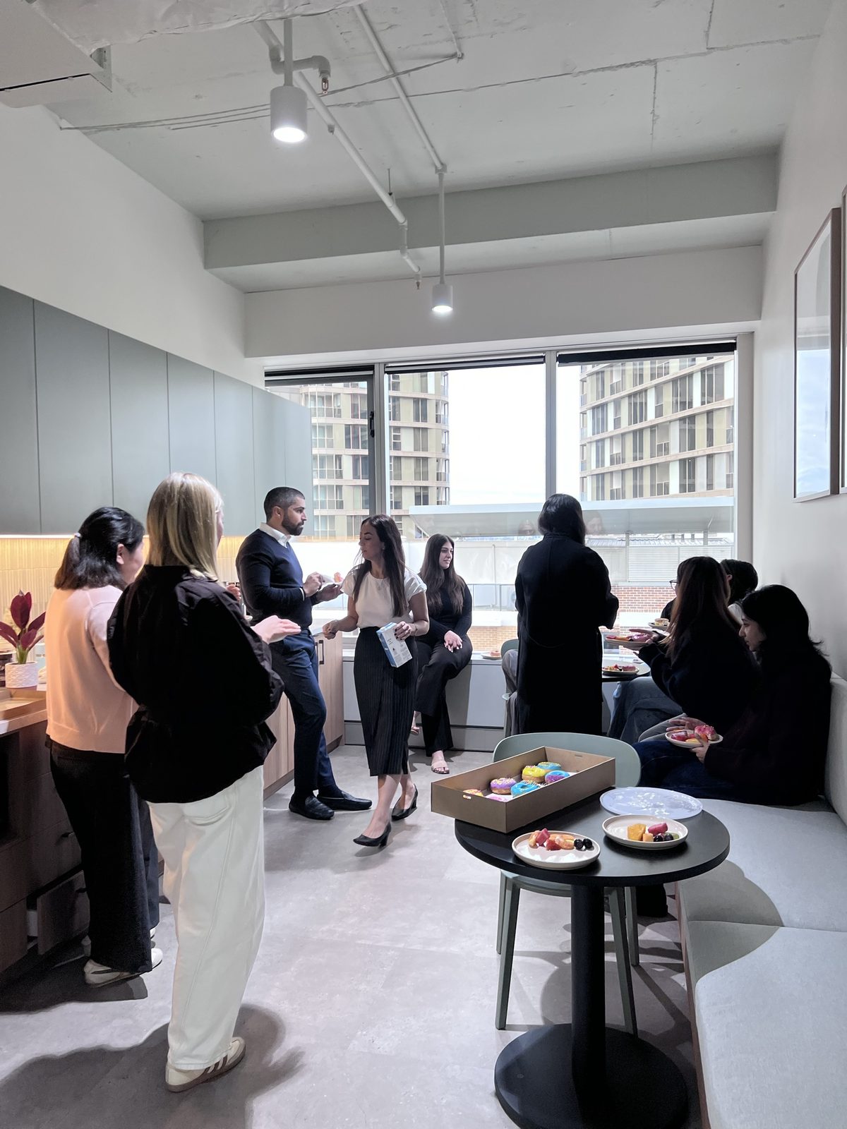 The Withstand Lawyers team catching up in the office kitchen