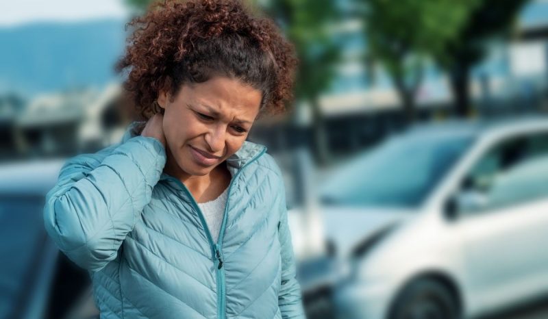 woman hold his neck after a motor vehicle accident